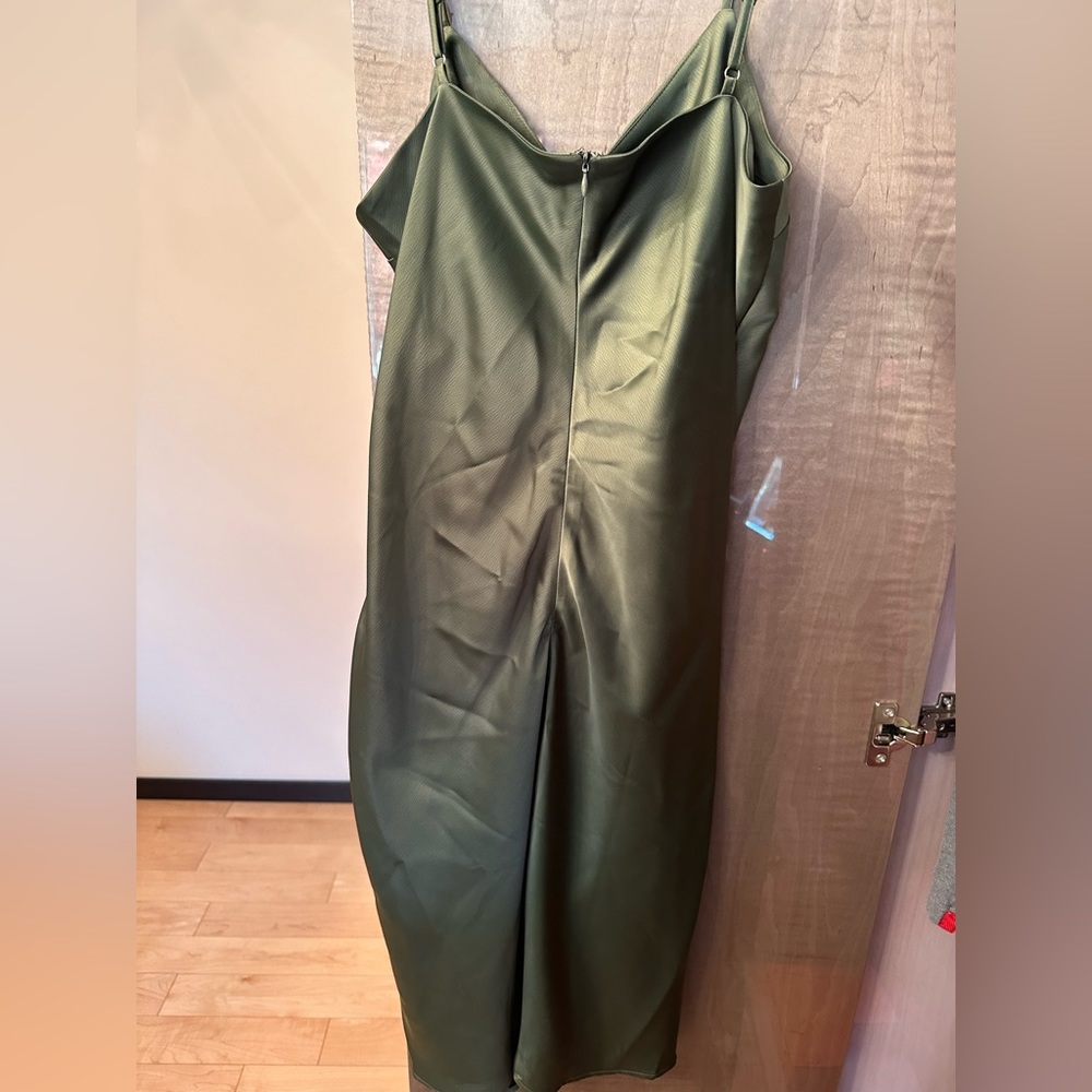 Brand new silk styled body dress with a slit